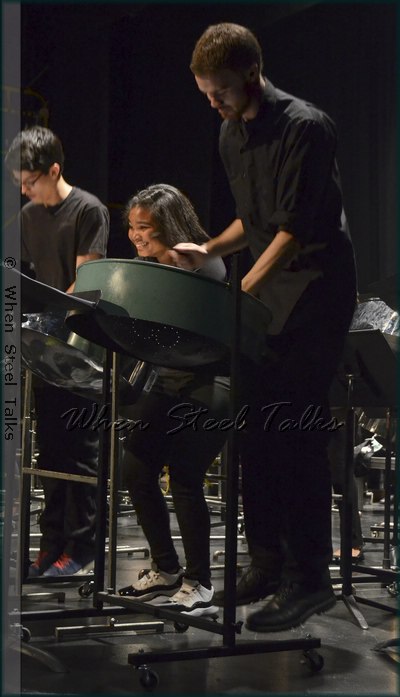 The feet of Greg Auffredou (right) leave the ground as he jumps for joy during performance