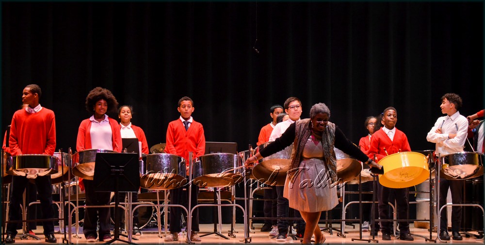 Philippa Schuyler Middle School Steelpan music director Nyasha Rhoden graciously acknowledges applause after the Steelpan Ensemble's performance