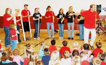 Stan Dahl and the Flying Pans from Central College demonstrate the use of bamboo poles for music at a demonstration at SIEDA Head Start in Oskaloosa Tuesday