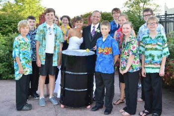 The Hanover Steel Drum players pose with bride Tiffany Getty and groom Daren Getty at Links Golf Course in Gettysburg.