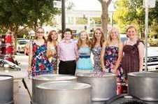 Members of the Oakdale Junior High School Steelband pose in front of their steel pans in downtown Modesto where they became finalists in the Gallo Center for the Arts’ Valleys Got Talent 2013 competition. In random order, members are Hailey Brown, Liz White, Lacie Blount, Sophie Jones, Jenni Shaefle, Sarah Hammoudi, and Ryan Hodge. Not pictured: Meghan Caron and music director Ross McGinnis.