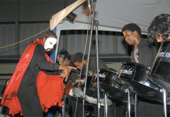 Silver Stars conductor Donnell Thomas known for his theatricality had patrons at Pan with the Saints intrigued by his costume for the band’s performance of music from Phantom of the Opera