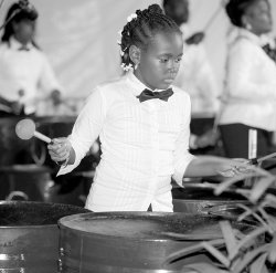 This little woman from San City Steel Symphony is focused during the bands performance of the test piece Mr Pan Maker.