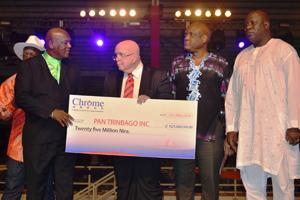 PRIZE MONEY: Pan Trinbago president Keith Diaz, left, receives the cheque from William Bucknam as High Commission to Nigeria Nyahuma Obika and Nigerian High Commissioner Musa John Jen look on.
