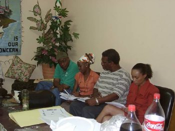 Some members of the PSCC in deep discussion; from left: Ian Teddy Belgrave, Nubia Williams, Gofrey Joseph, Amanda De Silva.