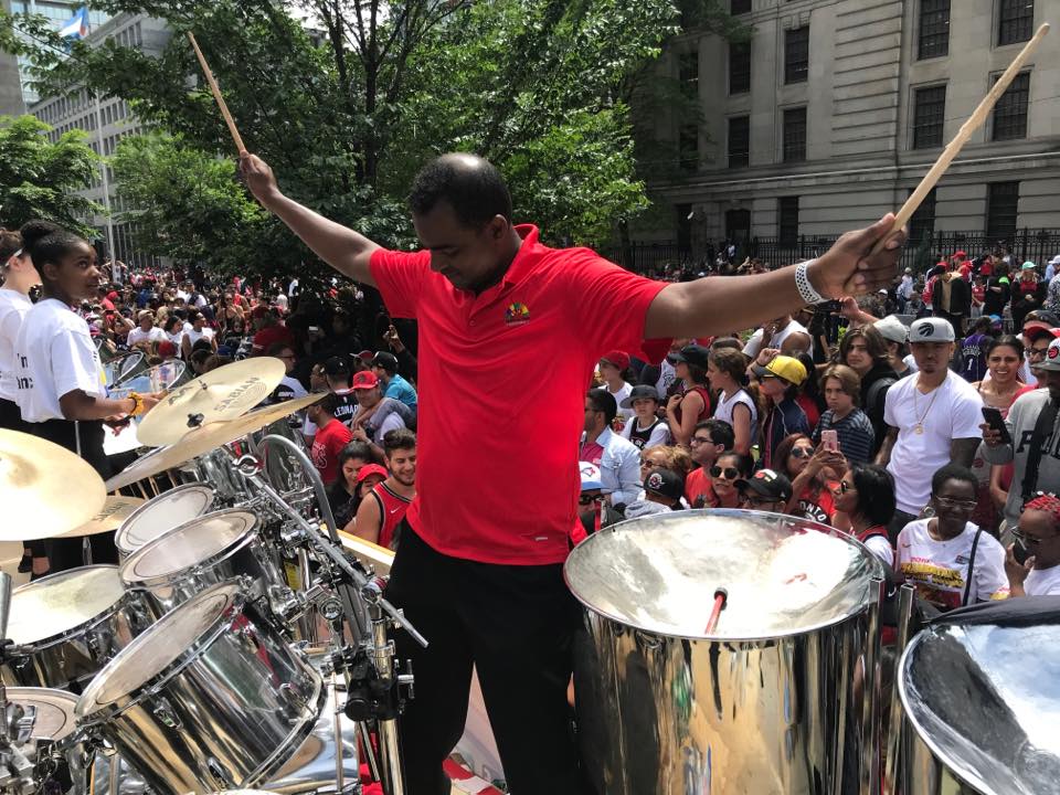 Salmon Cupid directing Toronto All Stars Steel Orchestra at the Raptors parade in 2019
