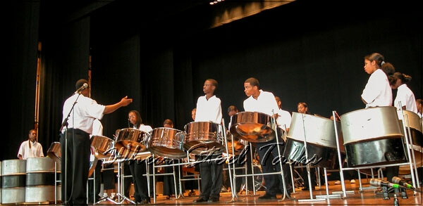 “Franklin” Gerald conducts the steel orchestra as they render ‘Be Still My Soul’
