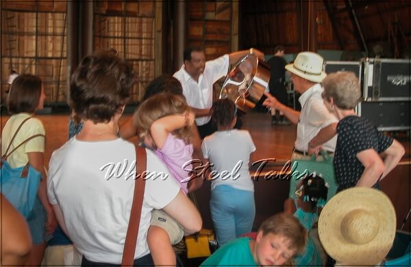 People gather round and get a close look at the steelpan