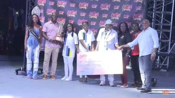 Pantime Steel Orchestra with trophy and check - as 2025 St. Lucia National Panorama Champions