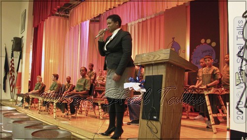 Nyasha Rhoden - Steelpan Music Director, Philippa Schuyler - addresses the audience