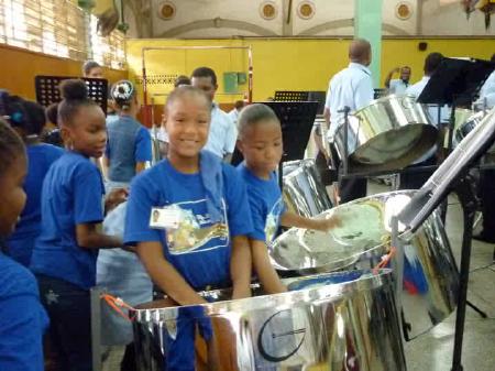 Students enjoy a steelpan class in the workshop