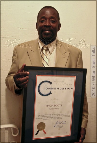 Honoree Mack Scott, leader and president of Sonatas Steel Orchestra, holds 2010 Commendation Award