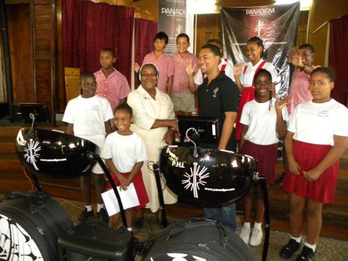 Representative of Panadigm Innovations Ltd hands over P.H.I.s to St. Xavier's Private School