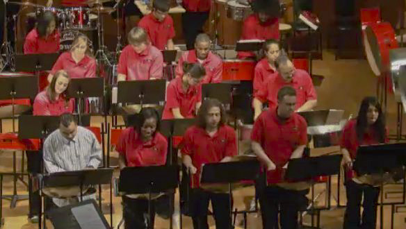 Liam Teague (left) performs with the NIU Steelband for their 2010 Fall concert