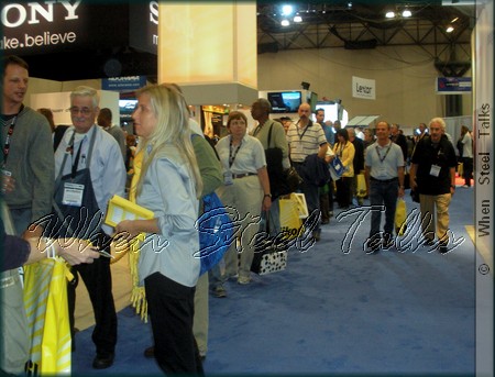 Attendees stand in line for product giveaway from the Nikon booth at the 2010 Photoplus Expo