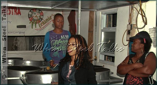 Karen Deane (right) watches over Latavia (left) while she's on tenor bass in 2010