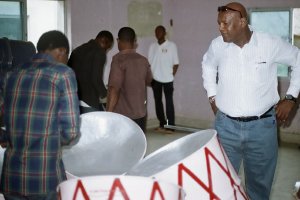 Looking on at steelpan instruments produced by Panland