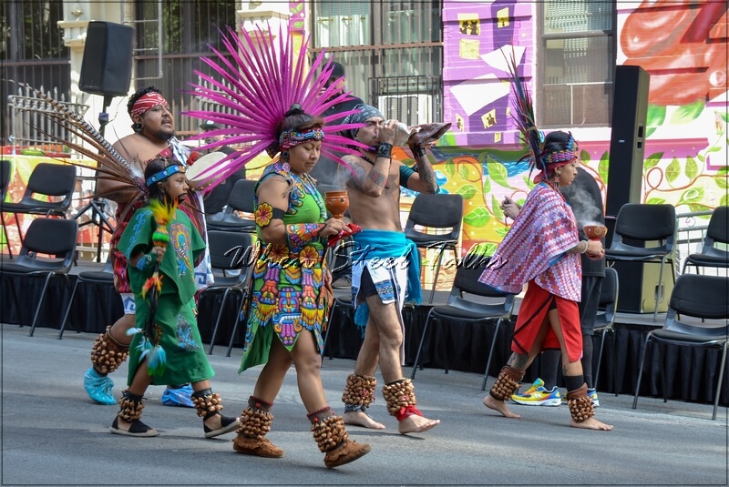 Grupo Tolteca Chichimeca in procession along  East 101st Street