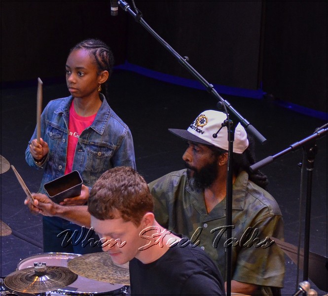 Dr. Kendall K. Williams on drums with NYU Steel, and daughter Madison to his right, on cow bell
