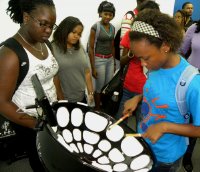 UWI student tries out the PHI