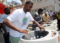 Salmon Childs, inventor of the e-pan, an electronic version of the steel drum, or pan, performs at the launch of Caribana