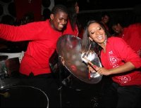 Silver Stars double second player Shannon McDavid, shows her versatility on the tenor pan belonging to Mark Jones at Saturdays season premiere of Parang and Steel, while he (Jones) jovially looks on