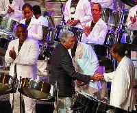 Pan arranger and composer, Ray Holman, centre, greets Exodus panists