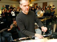 Composer Gary Gibson, of Edmonds, rehearses music he wrote with Choir of the Sound for the Washington state premier of In the Shadows of the Forest, March 7, at Terrace View Presbyterian Church in Mountlake Terrace.