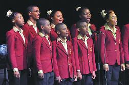 Having abandoned their instruments, members of the Diamond Vale Government Primary School Steel Ensemble render The Song of Music trilogy