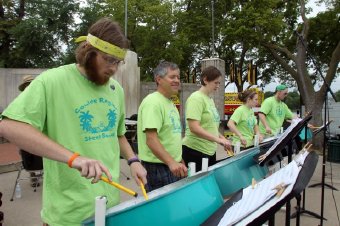 Alec Beron (foreground), a 2012 Onalaska High School graduate, plays the "lead" pan in the Coulee Region Steel Band at Riverfest