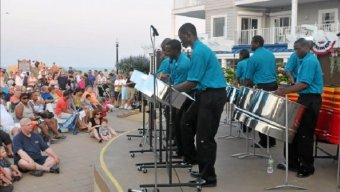 Members of the Virgin Islands National Guard's steel drum ensemble perform Friday at Bethany Beach boardwalk bandstand in Bethany Beach, Del.