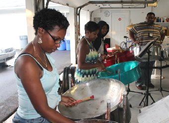 Drummers Gillian Salandy, Charlene Aldrin and Janae Salandy perform with Caribbean Steel Rhythms