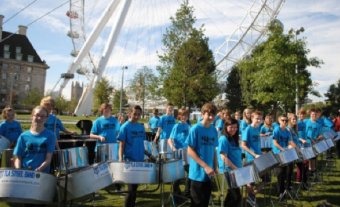 The TLA Steel Band members take their place beneath the London Eye to play in the record-breaking group of "1,000 Pans" at the Mayor's Thames Festival