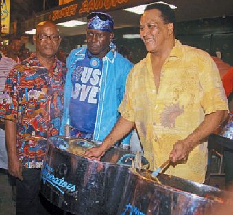 Current International Power Soca Monarch and Road March champion SuperBlue, centre, with his first arranger Pelham Goddard, left, and Witco Desperadoes arranger Robert Greenidge