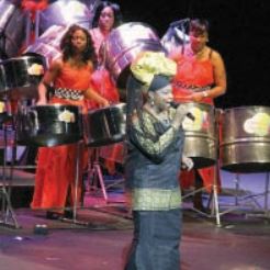 Karen Eccles performs accompanied by the Invaders Steel Orchestra