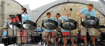 Members of Pantastic performing at the Art Couture Festival in Painswick