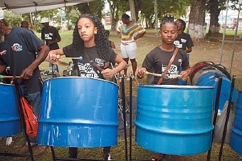 Young Unistars players entertain participants of Pan Trinbago northern region at Victoria Square following their march for peace from Morvant junction to Port-of-Spain