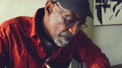 Artist, composer, writer, musician and pan man, Roy Crosse