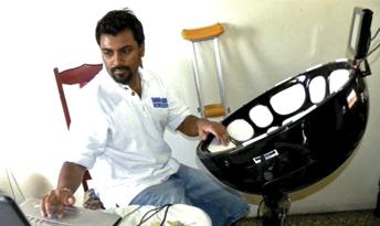 Amrit Samaroo arranges music using a Percussive Harmonic Instrument