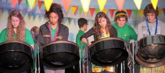 The Roseland Community College steel band Steel Roses performs at its Caribbean evening.