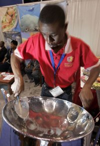 Darryl Reid plays the Steel Pan at the Trinidad and Tobago Caribbean cruise industry booth at the Seatrade Cruise Shipping convention Tuesday March 11, 2008 in Miami Beach, Fla.