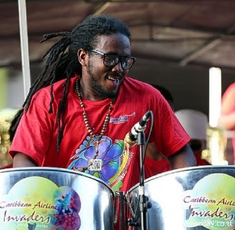 Pantastic: Matthew Best, panist with CAL Invaders enjoys their performance at the large band Panorama semis at Queen's Park Savannah, Port-of-Spain last Sunday. The band will play first at next Saturday's finals.
