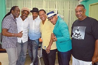 Robert Greenidge, third from right, is captured with musicians at last month's Tribute to Ralph Mac Donald, staged at Holy Cross College, Arima. Also in photo, from left, are Ragga, Nicholas Brancker, Marcus Miller, Ettienne Charles and former Woodbrook councillor Cleveland Garcia.