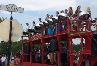 The Petoskey High School Steel Drum Band sometimes performs on their double decker trailer.