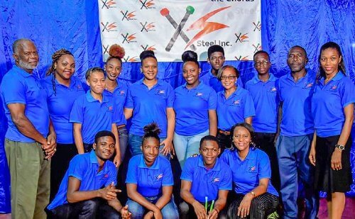 Minister of Education Anthony Garcia (right), gives Northeastern Sangre Grande Government ECCE administrator Zobida Ali-Mannan (left), a steelpan as part of the Music Education Expansion Initiative project. The event was held at the Arima New Government Primary School, Tumpuna Road South, Arima, Wednesday. 
