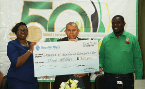 Ms Jonelle Dummett, Acting Manager, Communications Department of Republic Bank Limited; Minister of Social Cohesion, Culture, Youth and Sport, Dr George Norton, along with the Mashramani Coordinator Andrew Tyndall during the presentation of three million dollars to fund the Pan-O-Rama Steel Pan Competition