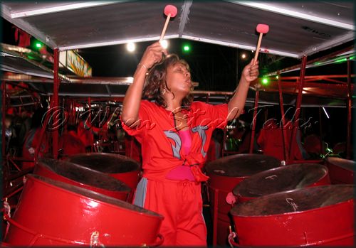 Woman on the Six Bass performing with Phase II Pan Groove at the annual Trinidad & Tobago National Panorama