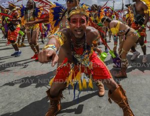 On Carnival Tuesday in 2020 these Paparazzi mas band revellers portray Hidden-Masters of Disguise at the Queen's Park Savannah, Port of Spain
