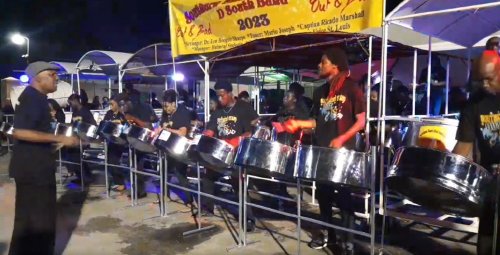 Dr. Len “Boogsie” Sharpe with Southern Stars Steel Orchestra during the preliminaries