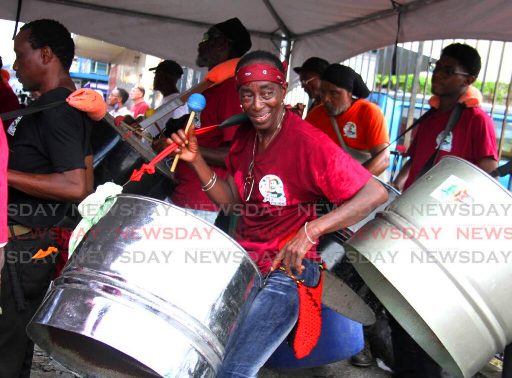 Jah Roots Steelband perform during World Steelpan Day celebrations on Duke Street, Port of Spain, on Friday